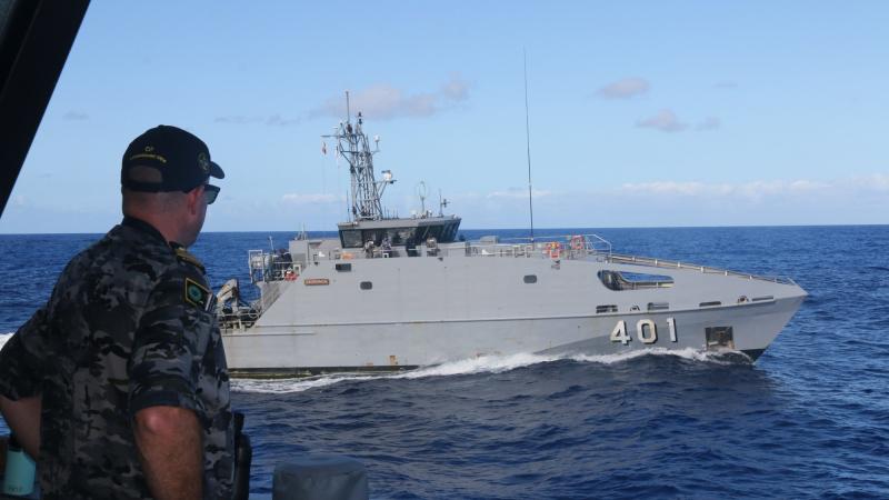 Commanding Officer HMAS Ararat Lieutenant Commander David Martinussen watches RFNS Savenaca complete a replenishment-at-sea approach during a combined patrol on Operation Solania 2022.