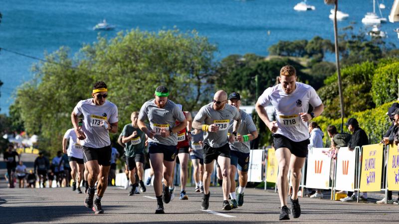 Personnel from HMAS Penguin run up Awaba Street in the 2022 Humpty Dumpty Balmoral Burn in Sydney. Photo: Leading Seaman David Cox