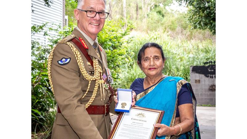Chief of Army Lieutenant General Rick Burr, with 1st Division's Dr Madhu Patel, celebrating her 50 years of service in the Australian Army at Gallipoli Barracks in Brisbane, Queensland. Photo: Corporal Miguel Anonuevo