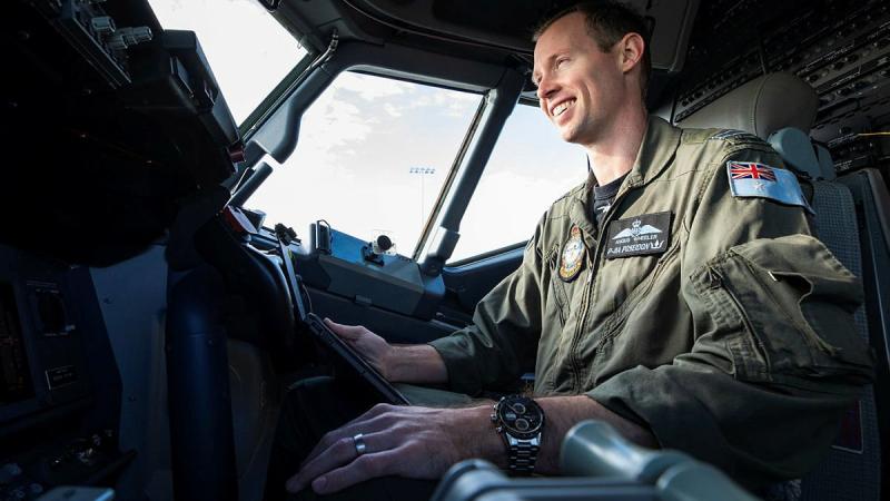 Pilot Flight Lieutenant Angus Wheeler, from No. 292 Squadron, plans the departure and arrival for an upcoming mission in the flight deck of a P-8A Poseidon aircraft at RAAF Base Edinburgh. Photo: Leading Aircraftman Sam Price