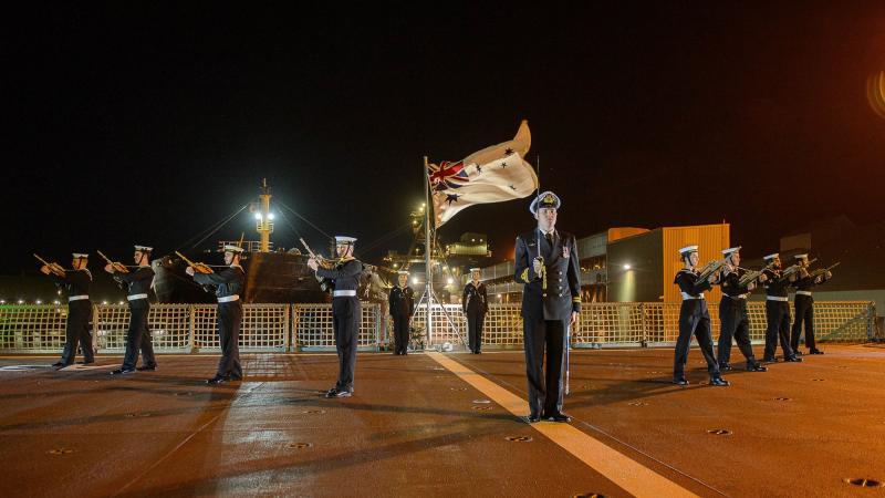 HMAS Stalwart's ceremonial guard conducts a ceremonial sunset at the ship's official reception during its inaugural port visit to Geraldton, Western Australia. Photo: Sergeant Gary Dixon