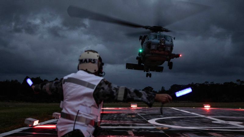 A Navy MH-60R Seahawk helicopter, such as this one, was involved in the rescue of three residents from Kangaroo Valley who were trapped by flood waters. 