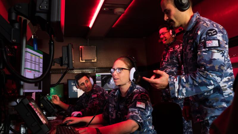 Air Surveillance Operator Sergeant Jayne Francis monitors the exercise airspace inside an operations cabin with aviators from No. 114 Mobile Control and Reporting Unit at RAAF Base Darwin. Photo: Leading Aircraftman Sam Price