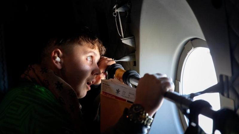 Chris Goodrum (17 years old) from The Murri School, also known as The Aboriginal and Islander Independent Community School at Acacia Ridge, staring out the window of C-27J Spartan, as part of a NAIDOC Week visit to RAAF Base Amberley.