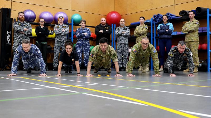 ADF personnel, Defence civilians and a member from the New Zealand Defence Force, at Head Quarters Joint Operations Command, after completing the push-up challenge. Photo: Sergeant Matthew Bickerton