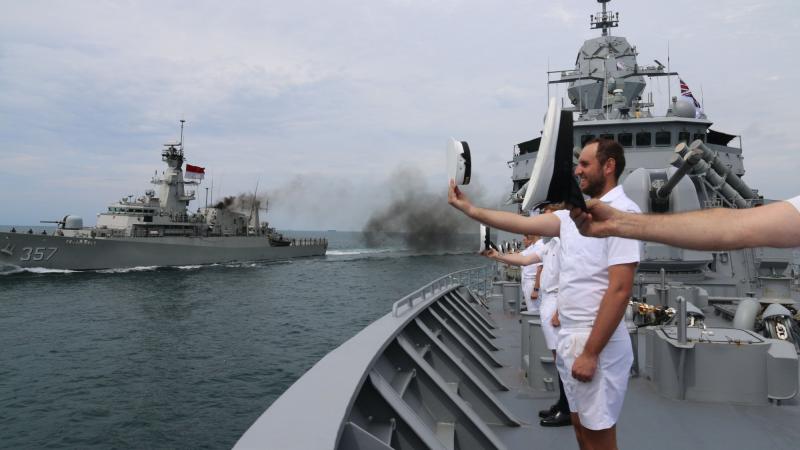 Ship's company of HMAS Perth ‘cheer ship’ to Indonesian Navy ship KRI Bung Tomo during a cooperative activity near Jakarta, Indonesia. 
