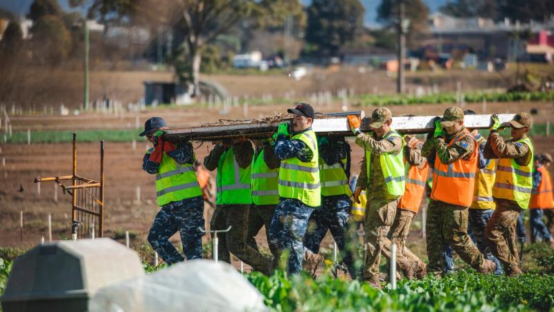 Australian Defence Force personnel assist homeowners affected by floods in Mulgrave. Photo: Leading Aircraftman Adam Abela