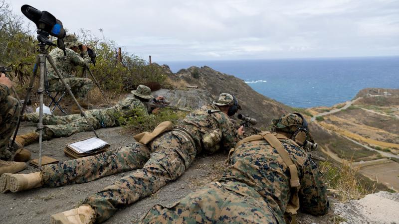 Snipers from the United States Marine Corps and Mexican Naval Infantry Corps aim at marathon targets during a sniper live fire exercise on RIMPAC 2022. Photo: Corporal John Solomon