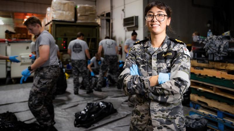 Environmental officer Lieutenant Somaia Ahmadi supervises environmental garbage sorting on HMAS Canberra during Exercise Rim of the Pacific 2022. Photo: Leading Seaman Matthew Lyall