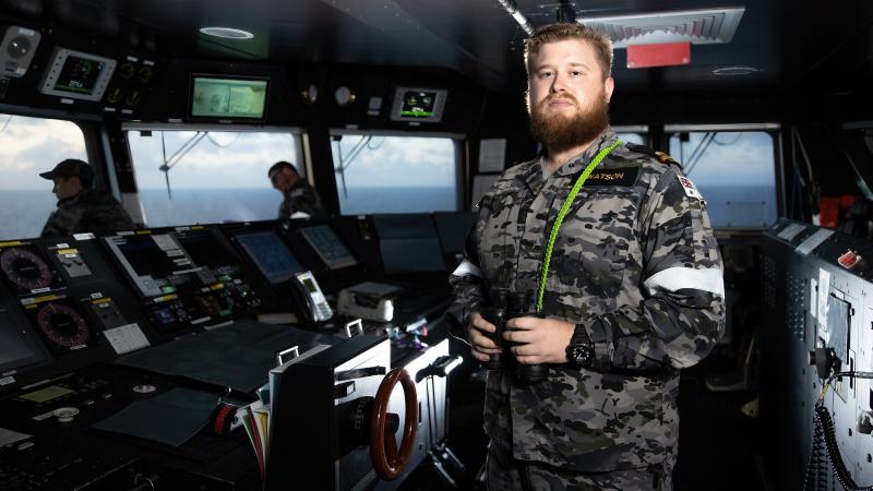 Sub Lieutenant Thomas Watson keeps watch on the bridge of HMAS Canberra during Exercise Rim of the Pacific (RIMPAC) 2022. Photo: Leading Seaman Matthew Lyall