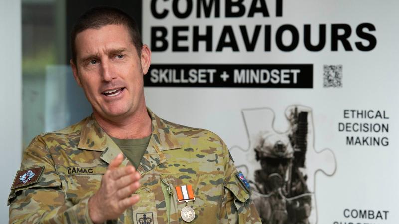 Warrant Officer Class Two Stuart Camac briefed 7th Brigade on his rotation to Egypt after being presented the Multinational Force and Observers Medal as he was farewelled from 26 years full time service. Photo: Major Roger Brennan