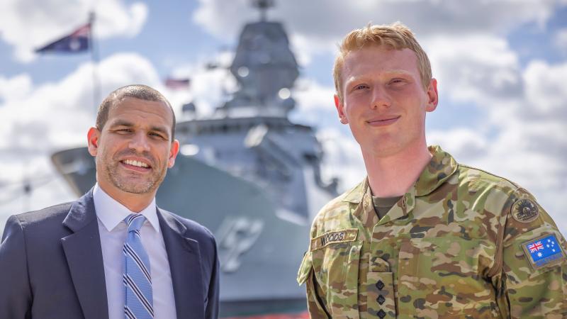 US Special Agent Justin Smith and Australian Army Captain Nicholas Wood pose in front of Royal Australian Navy frigate HMAS Warramunga at Joint Base Pearl Harbor-Hickam during Exercise Rim of the Pacific (RIMPAC) 2022. Photo: Leading Seaman Kylie Jagiello