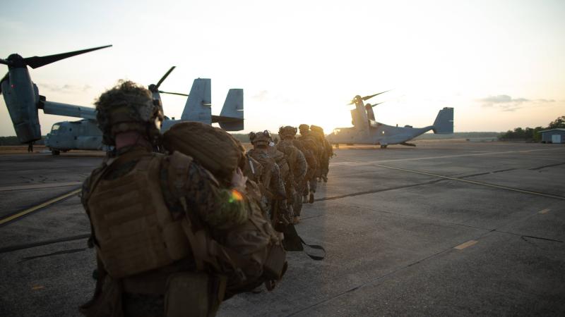US Marines with 3d Battalion, 7th Marine Regiment, Ground Combat Element, Marine Rotational Force – Darwin load an MV-22 Osprey during an airfield seizure event at RAAF Base Darwin as part of Exercise Koolendong 2022. Photo: Corporal Cedar Barnes