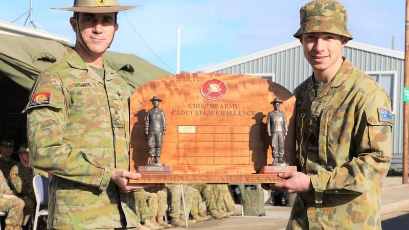 Chief of Army Lieutenant General Simon Stuart presents the Chief of Army trophy to Cadet Under Officer Kane Blake, leader of the winning team from the Victorian Army Cadets Brigade. Photo: Supplied