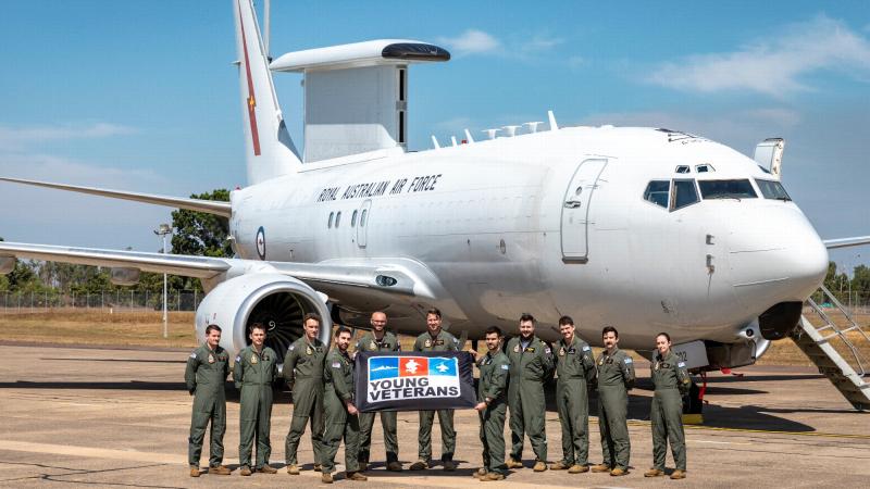 Personnel from No. 2 Squadron, supporting Young Veterans at RAAF Base Darwin during Exercise Diamond Storm, stand in front of an E-7A Wedgetail. This image has been digitally altered. Photo: Leading Aircraftman Samuel Miller