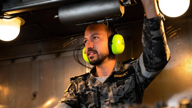 Sub Lieutenant Jackson Harvey conducts maintenance checks on the gas turbine on board HMAS Warramunga while on deployment. Photo: Leading Seaman Daniel Goodman