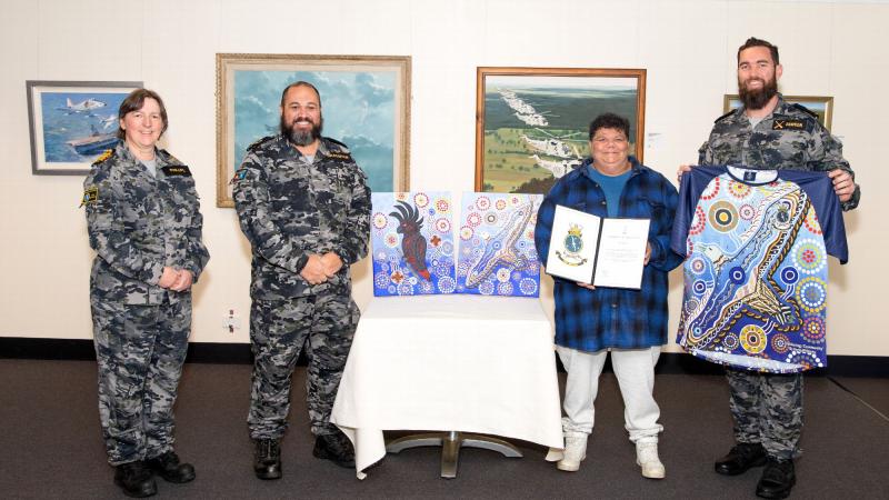 Captain Robyn Phillips, left, Petty Officer Jordon Bradshaw, Indigenous artist Kerrie Williams and Leading Seaman Callum Dawson at the Fleet Air Arm museum in Nowra. Photo: Leading Seaman Ryan Tascas