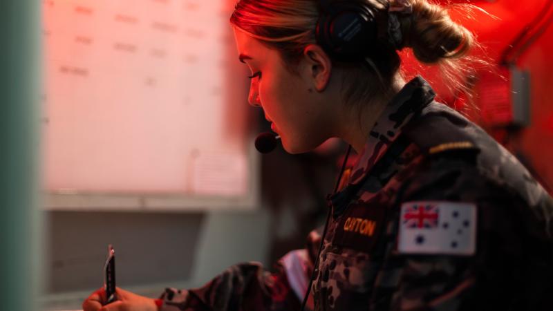 Able Seaman Chelsea Clayton works on the bridge of HMAS Warramunga during Exercise Rim of the Pacific (RIMPAC) 2022. Photo: Leading Seaman Daniel Goodman