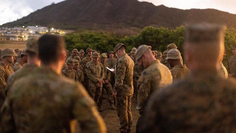 Captain David Wohlgemuth from the 2nd Battalion, Royal Australian Regiment reads the soldiers a prayer at a memorial service for the 69th anniversary of the Battle of Samichon at Marine Corps Base Hawaii. Photo: Leading Seaman Jarrod Mulvihill