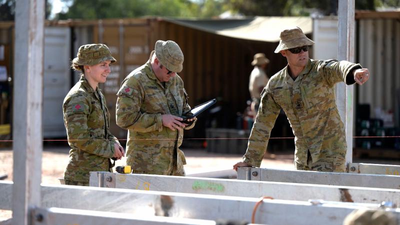 Captain Verity Farragher, left, with Warrant Officer Class Two Paul Thompson and Warrant Officer Class Two Phillip Harris conduct a site inspection during the Army Aboriginal Community Assistance Program in Gapuwiyak. Photo: Corporal Lucas Petersen