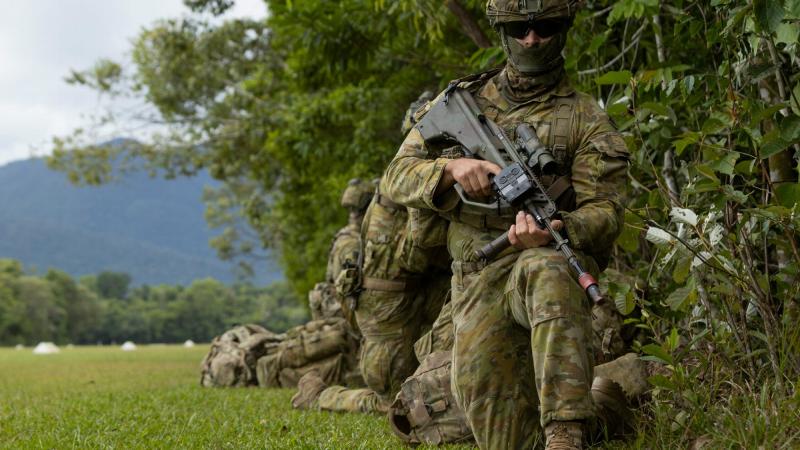 An Australian Army soldier from the 3rd Battalion, Royal Australian Regiment, provides security at Jungle Training Wing, Tully, during Exercise Kalimantan. Photos: Bombardier Guy Sadler 