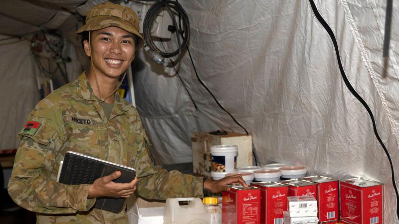 Private Maria Aniceto checks the stock levels of catering supplies in the deployable catering capability at Camp Birt during the Army Aboriginal Community Assistance Program in Gapuwiyak. Photo: Warrant Officer Class Two Kim Allen