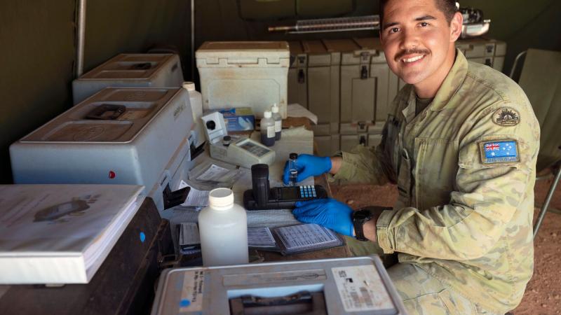 Private Adrian Fleming completes a daily field test of the purified water at Camp Birt during the Army Aboriginal Community Assistance Program in Gapuwiyak, Northern Territory. Photo: Warrant Officer Class Two Kim Allen