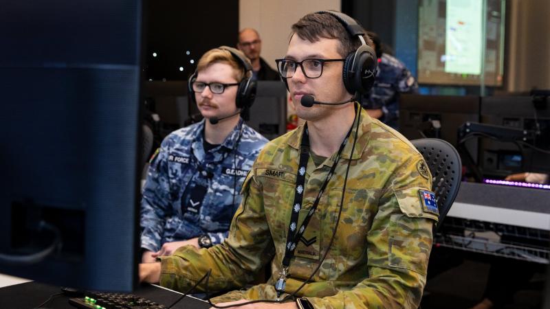 Corporal Jackson Smart, right, takes part in the space training exercise with Air Force air surveillance operator Leading Aircraftman Jasper Gleadhill at the Australian Space Discovery Centre. Photo: Leading Aircraftwoman Annika Smit