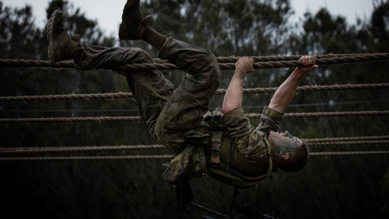 An Australian Army soldier from the 6th Battalion, Royal Australian Regiment, moves across the traverse ropes during an obstacle course activity held as part of the Duke of Gloucester Cup in Singleton. Photos: Corporal Madhur Chitnis