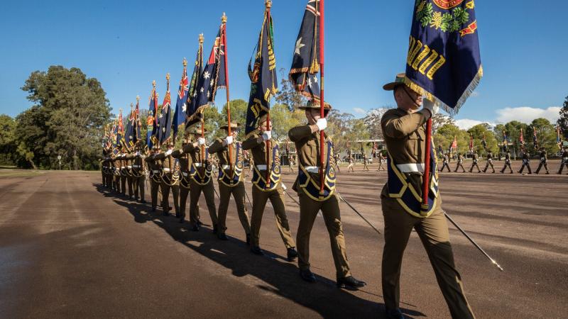 Australian Army soldiers from the Royal Australian Infantry Corps parade their battalion colours during a ceremony held at the School of Infantry in Singleton to celebrate Queen’s Platinum Jubilee. Photo: Corporal Madhur Chitnis
