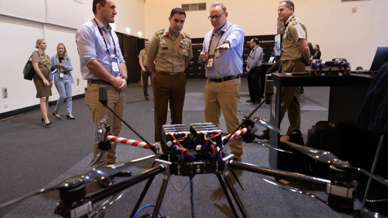 Chief of Army Lieutenant General Simon Stuart speaks with industry representatives during the Chief of Army Symposium 2022 at the Adelaide Convention Centre. Photo: Sergeant Tristan Kennedy