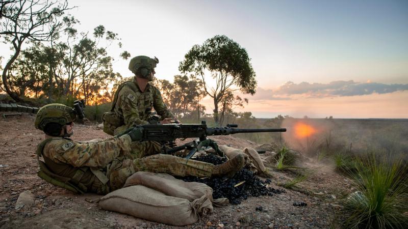 Riflemen from 6RAR fire a .50 calibre heavy machine gun during the course at Wide Bay training area. Photo: Cpl Nicole Dorrett