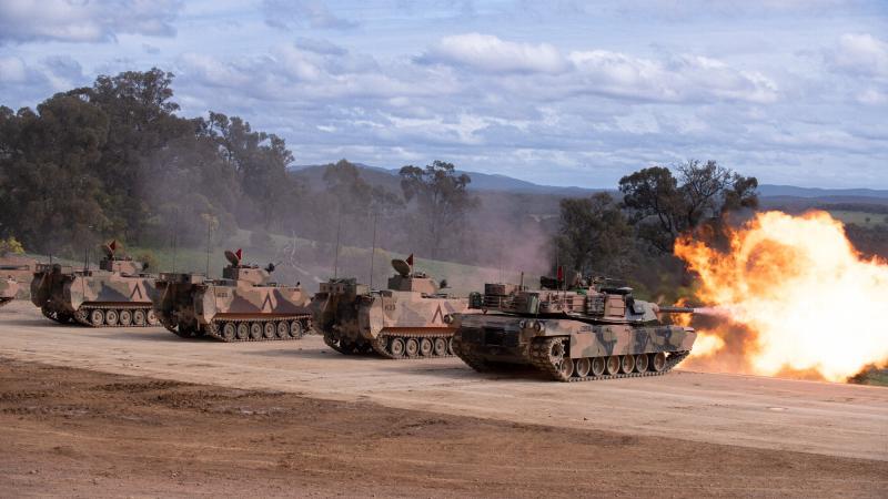 Vehicles from the School of Armour fire on target during the firepower demonstration at Puckapunyal Military Area on August 17. Photos: Private Michael Currie