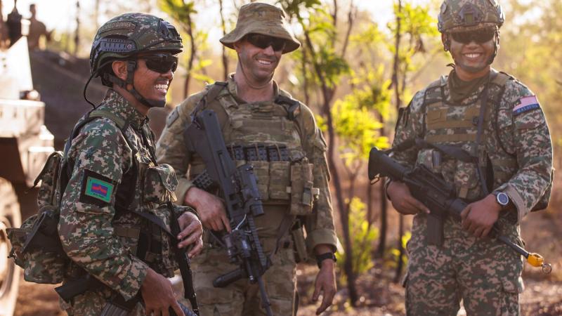 From left, Malaysian Armed Forces Battery Commander Major Fahmi A. Razak, Australian Army Command Post officer Lieutenant Toby Exton and Malaysian Armed Forces Forward Observer Captain Shauqi. Photos: Corporal Dustin Anderson