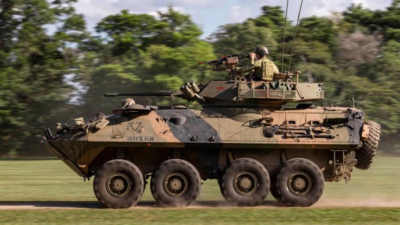 Soldiers from 2nd/14th Light Horse Regiment (Queensland Mounted Infantry) mounted in an Australian Light Armoured Vehicle conduct integration training with US Marines. Photos: Corporal Nicole Dorrett