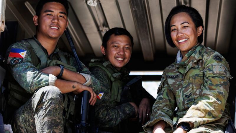 Australian Army Corporal Aiko Gabriel, right, with Philippine Army Private First Class John Paul Madriaga, left, and 1st Lieutenant Karl Philip A.Amantillo during Exercise Predators Run. Photo: Corporal Dustin Anderson
