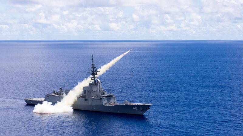 Hobart-class guided missile destroyer HMAS Sydney strikes a land target with a Harpoon surface-to-surface missile during Exercise Pacific Vanguard 2022.