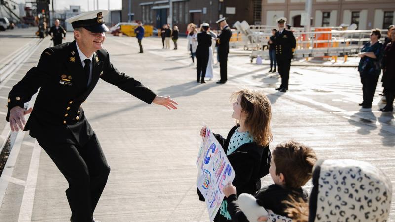 Family and friends welcome home their loved ones on board HMAS Canberra as the ship returns to Fleet Base East following a regional presence deployment. Photo: Able Seaman Callum Davis