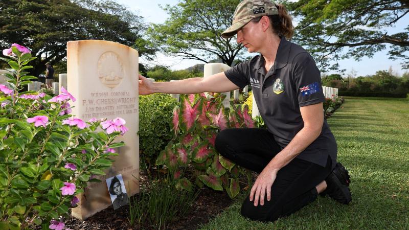 Lieutenant Lorraine Cheesewright pays her respects at the grave of her great uncle, Corporal Frederick Cheesewright at the Port Moresby (Bomana) War Cemetery in Papua New Guinea. Photo: Warrant Officer Class Two Max Bree
