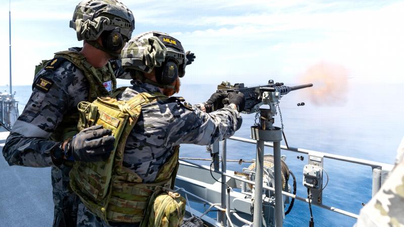 HMAS Perth boatswain’s mates Able Seaman Patrick Kehoe and Seaman Mitchell Milne fire a 12.7mm Browning machine gun while conducting anti-aircraft firing serials. Photos: Leading Seaman Jarryd Capper