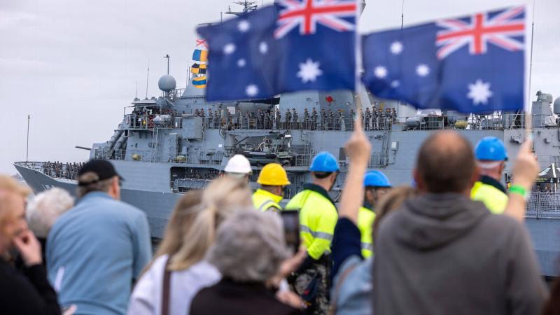 Family and friends wait on the wharf as HMAS Warramunga returns to Australia after completing a regional presence deployment. Photos: Chief Petty Officer Yuri Ramsey