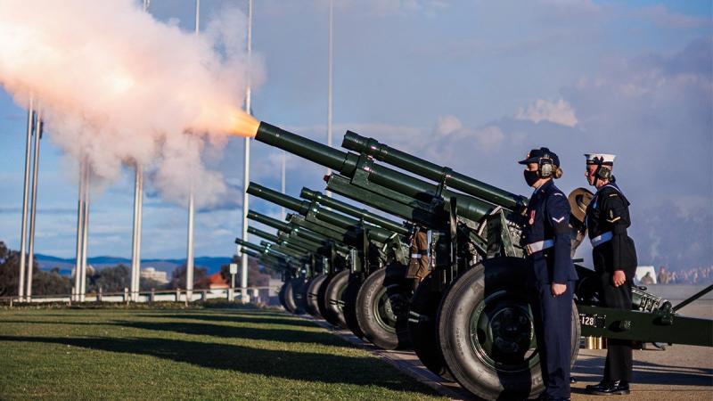 Members of Australia's Federation Guard fire a M2A2 howitzer ceremonial gun during a 96-gun salute held at Parliament House in Canberra to honour the passing of Her Majesty The Queen. Photo: Corporal Cameron Pegg