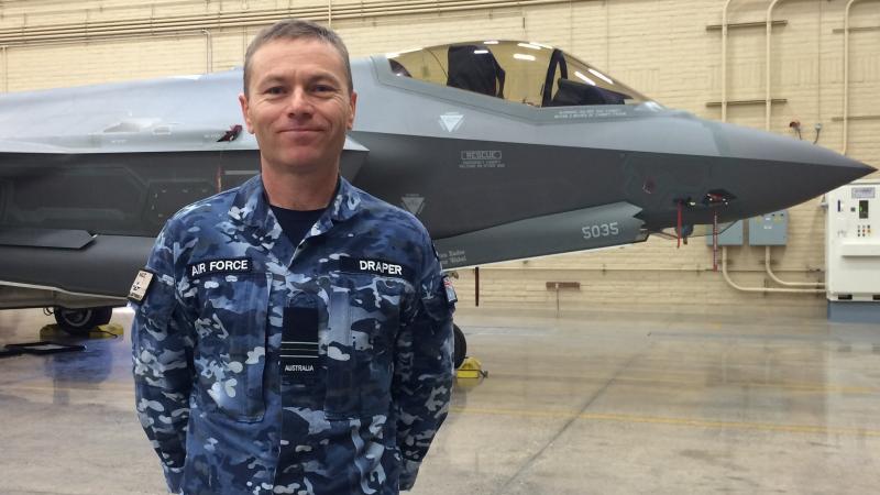 Wing Commander (then Squadron Leader) Nathan Draper stands in front of a United States Air Force F-35A aircraft at Luke Air Force Base, US, in 2016. Photo: Leigh Watson