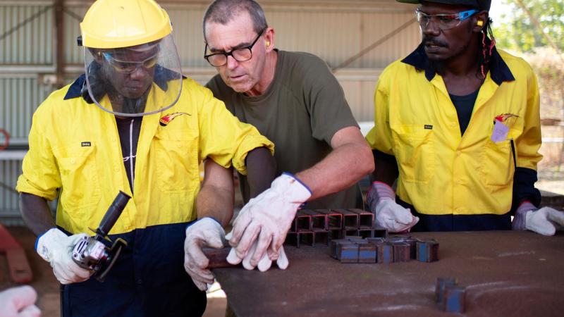 Sapper Malcolm Stewart, from 6th Engineer Support Regiment, delivers trade training to trainees Jonathon Guyula and Alistair Mununggurr during the Army Aboriginal Community Assistance Program in Gapuwiyak. Photos: Corporal Lucas Petersen