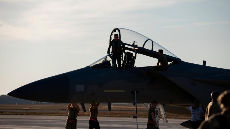 A US Air Force pilot prepares to exit an F-15C Eagle from 67th Fighter Squadron at RAAF Base Darwin during Exercise Pitch Black 2022. Photo: Leading Aircraftwoman Emma Schwenke