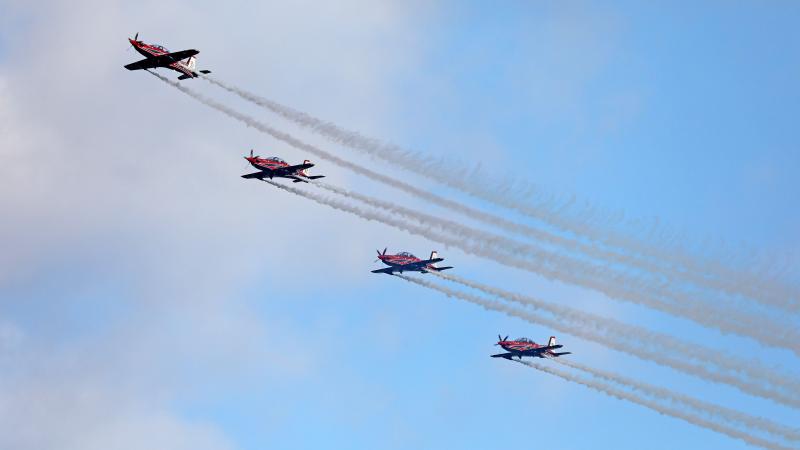The Air Force Roulettes perform an aerobatic display over the air traffic control tower for the Air Force Roulette's 50th anniversary family open day at RAAF Base East Sale, Victoria. Photos: Richard Prideaux