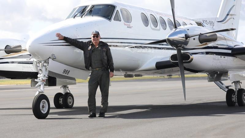 Wing Commander Adrian Burge, from 32 Squadron, at the completion of 10,000 military flying hours, in front of a B350 King Air at RAAF Base East Sale. Photo: Flying Officer Nathan Howarth