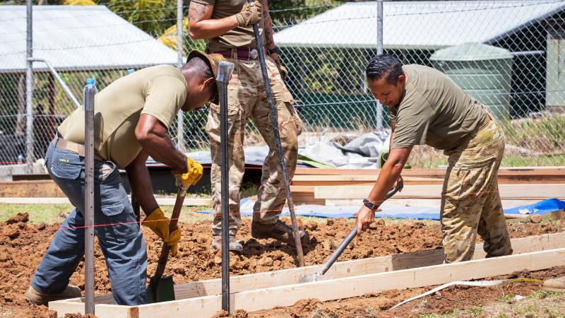 Australian Army Sapper Ingrid Reitermeier, right, works alongside Papua New Guinea Defence Force and British Army soldiers on site during Exercise Puk Puk at Goldie River Training Depot in Papua New Guinea. Photo: Sergeant Nunu Campos