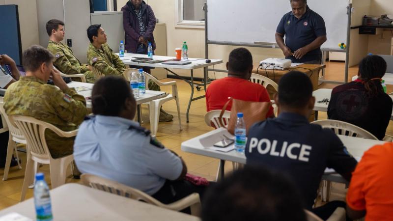 ADF members meet with members of the Solomon Islands Government to discuss humanitarian assistance and disaster relief in Honiara, Solomon Islands. Photo: Corporal Jonathan Goedhart