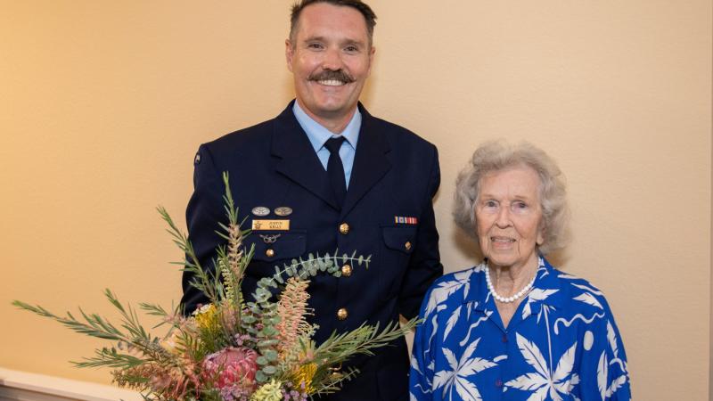 Jessie Strike-McClelland and Flight Lieutenant Justin Kelly with her 100th Birthday gift from the Australian Embassy at San Clemente Villas by the Sea, California. 